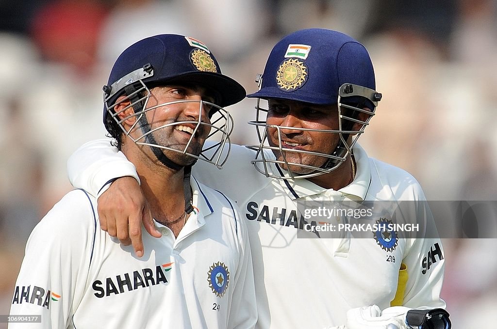 Indian cricketer Virendra Sehwag (R) sha