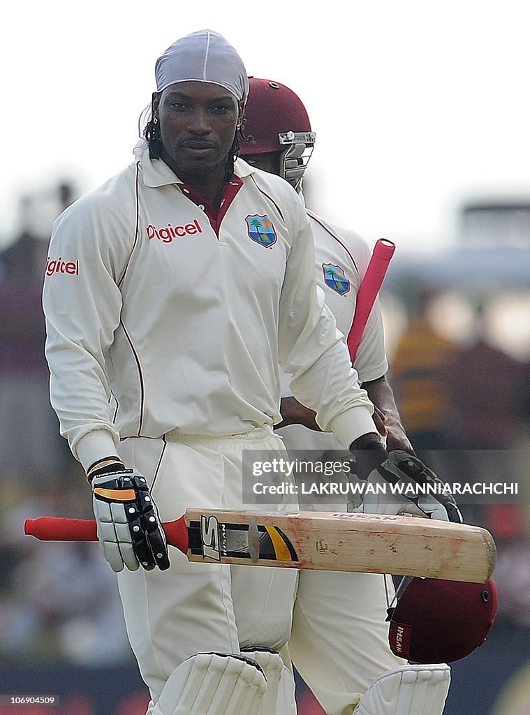 West Indies batsman Chris Gayle walks ba