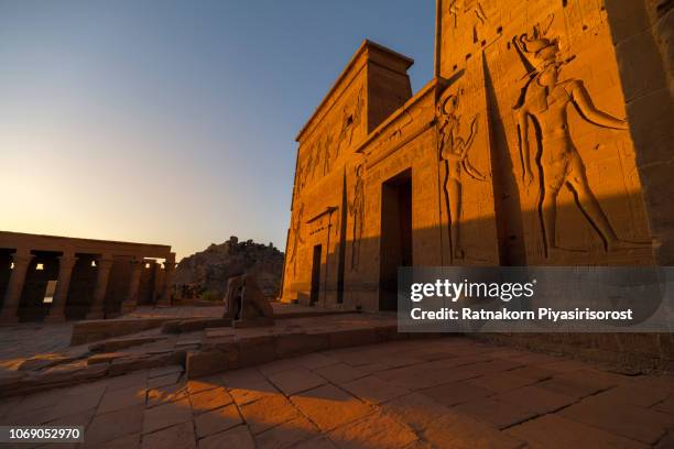 sunset scence view of philae temple on agilkia island in aswan, egpyt - view of philae stock pictures, royalty-free photos & images