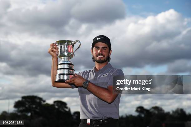 Abraham Ancer of Mexico poses with the Australian Open trophy during day four of the 2018 Australian Golf Open at The Lakes Golf Club on November 18,...