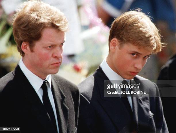 The son of Diana, Prince William , and her brother Earl Spencer wait in front of Westminster Abbey in London to attend the funeral ceremony of the...