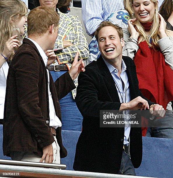 Prince Harry watches a Prince William dances during a performance at Wembley stadium in north London, 01 July 2007, as 60 000 revellers joined...