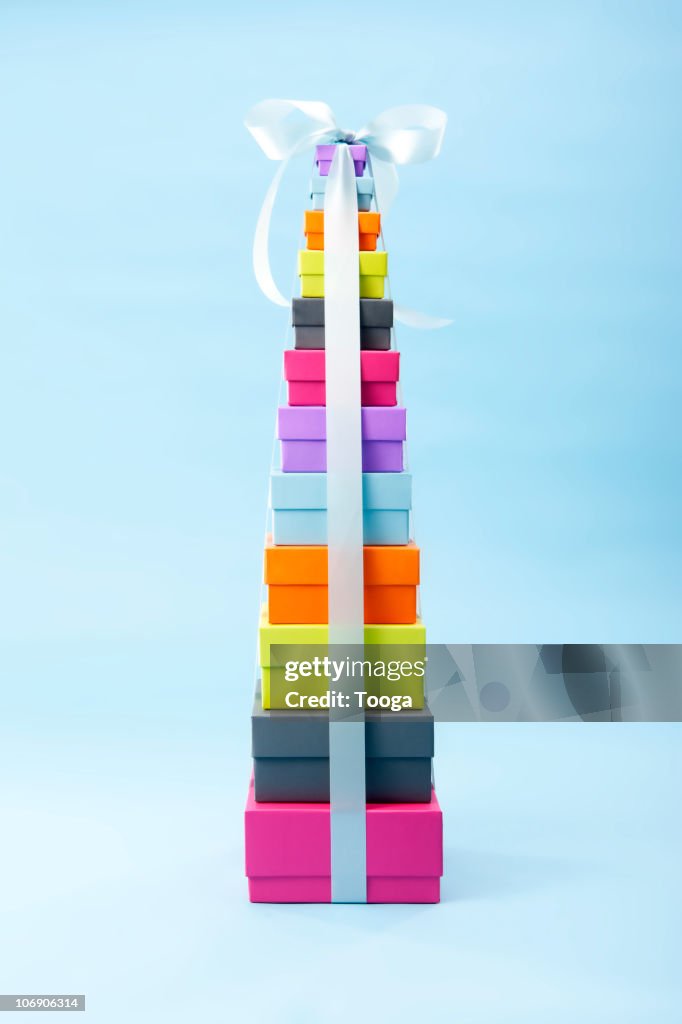 Pretty Present Stack Colorful Graduated Stack Of Presents With Ribbon High-Res Stock Photo ...