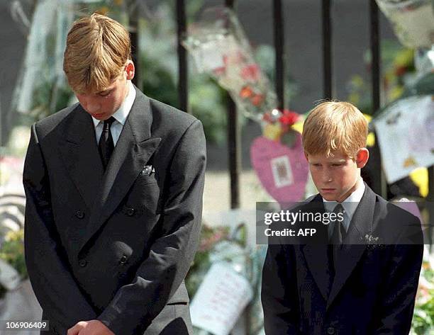 Prince William and Prince Harry, the sons of Diana, Princess of Wales, bow their heads as their mother's coffin is taken out of Westminster Abbey 06...