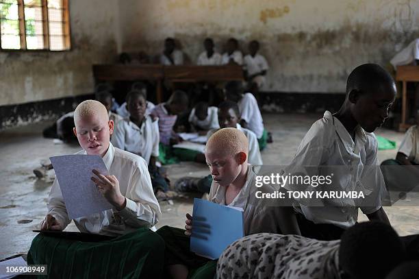 Albino children study on January 28, 2009 at the Mitindo Primary School for the blind, which has become a rare sanctuary for albino children. In...