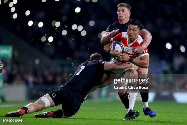 Akihito Yamada is tackled by Owen Farrell and Mark Wilson during the Quilter International match between England and Japan at Twickenham Stadium on...