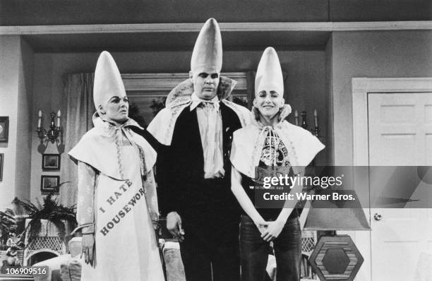 Canadian-American comedian Dan Aykroyd with actresses Jane Curtin and Laraine Newman as The Coneheads in a sketch from the TV comedy show 'Saturday...