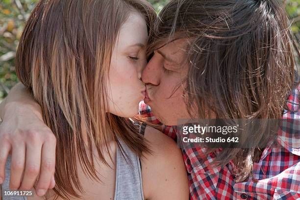 teenage couple kissing - girl of desire stock pictures, royalty-free photos & images