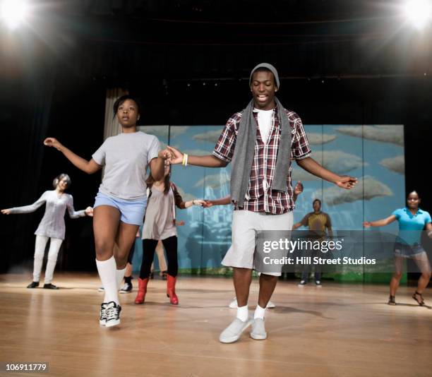 teenagers rehearsing on stage - 学芸会 ストックフォトと画像