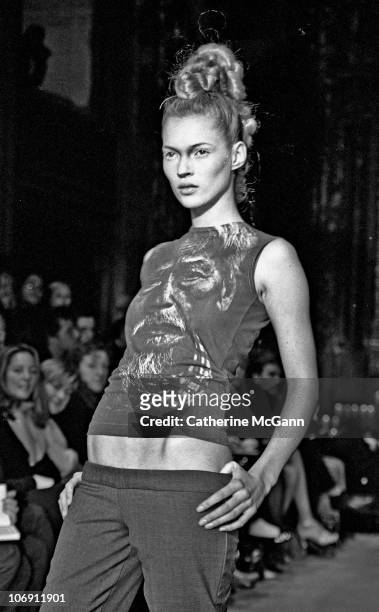 Model Kate Moss walks the runway at British fashion designer Alexander McQueen's first New York fashion show at a former synagogue on Norfolk Street...