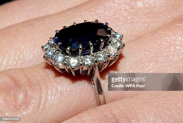 Close up of Kate Middleton's engagement ring as she poses for photographs in the State Apartments with her fiance Prince William of St James Palace...
