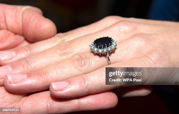 Close up of Kate Middleton's engagement ring as she poses for photographs in the State Apartments with her fiance Prince William of St James Palace...