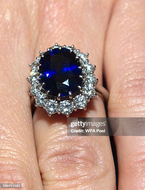 Close up of Kate Middleton's engagement ring as she poses for photographs in the State Apartments with her fiance Prince William of St James Palace...