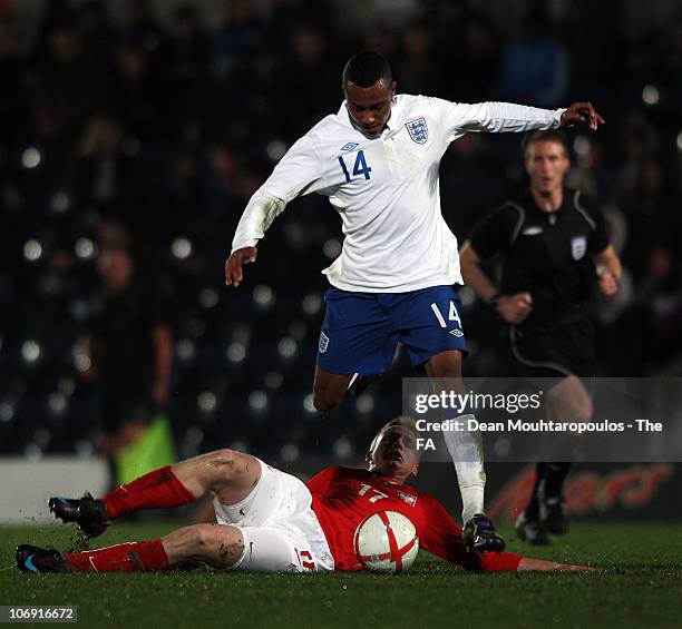 Jordan Obita of England is tackled by Piotr Piekarski of Poland during the International friendly match between England U18 and Poland U18 at Adams...