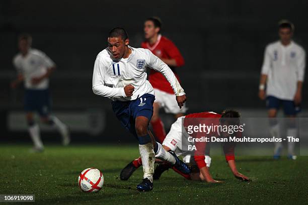 Alex Oxlade-Chamberlain of England gets past Patryk Fryc of Poland during the International friendly match between England U18 and Poland U18 at...