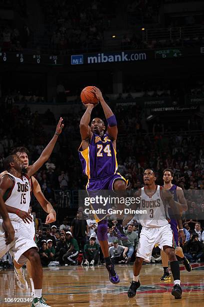 Kobe Bryant of the Los Angeles Lakers attempts a buzzer beater against John Salmons of the Milwaukee Bucks at the end of the first half of the NBA...