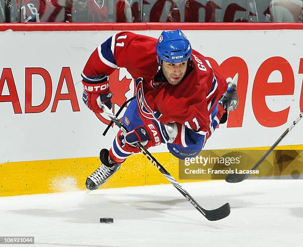 Scott Gomez of the Montreal Canadiens takes a quick flight over the ice during the NHL game against the Philadelphia Flyerson November 16, 2010 at...