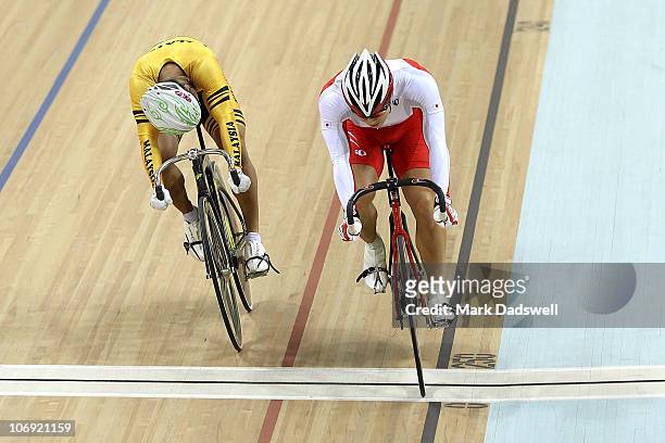 Yudai Nitta of Japan crosses the finish line to win the bronze medal ahead of Azizulhasni Awang of Malaysia in the men's sprint bronze medal final...