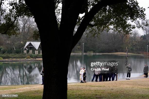 The flag-draped casket of former President George H.W. Bush is carried by a joint services military honor guard for burial at the George H.W. Bush...