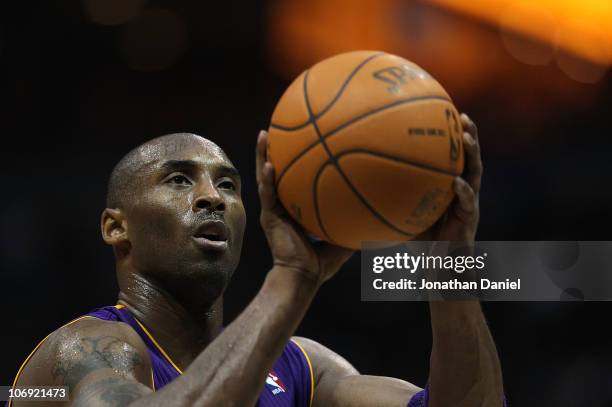 Kobe Bryant of the Los Angeles Lakers shoots a free-throw against the Milwaukee Bucks at the Bradley Center on November 16, 2010 in Milwaukee,...