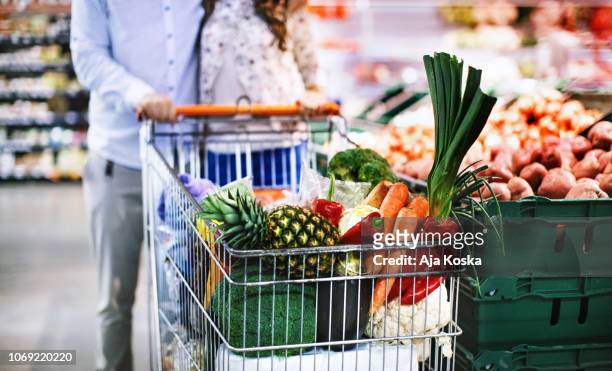 groceries shopping. - shopping cart groceries stock pictures, royalty-free photos & images