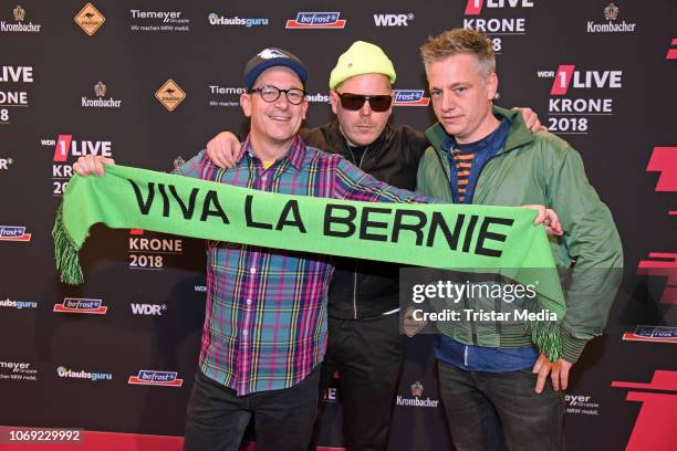 Martin Vandreier, Boris Lauterbach and Bjoern Warns of the band Fettes Brot arrive at the 1Live Krone radio award red carpet at Jahrhunderthalle on...