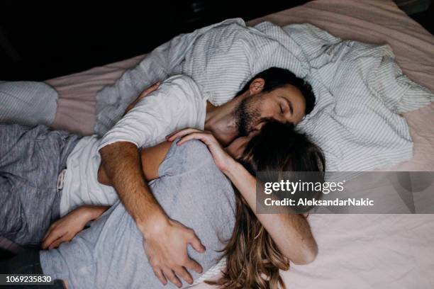 love and happiness - man and woman kissing in bed stock pictures, royalty-free photos & images