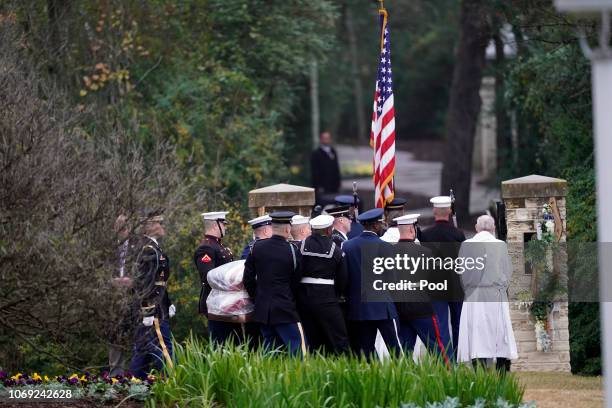 The flag-draped casket of former President George H.W. Bush is carried by a joint services military honor guard for burial at the George H.W. Bush...