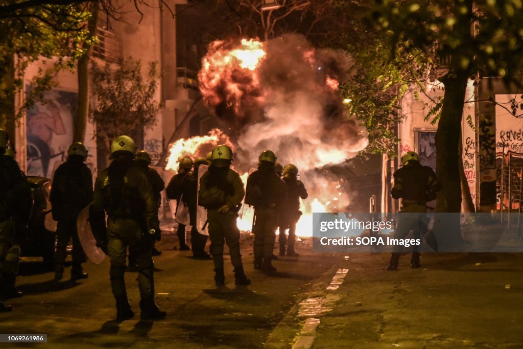 A fire is seen after protesters throw petrol bomb toward the...