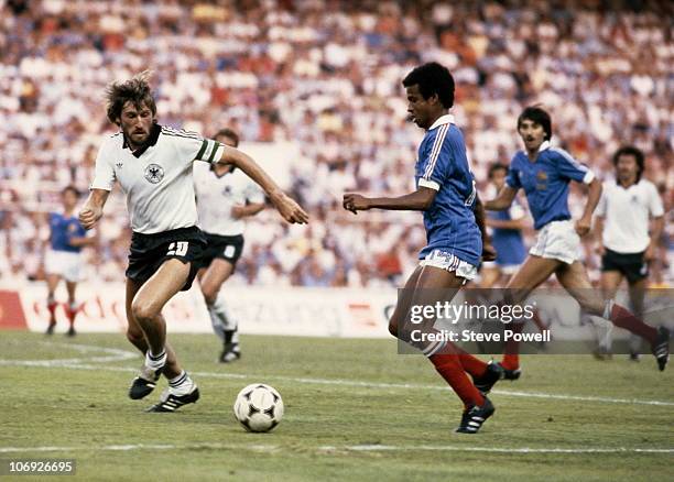 Jean Tigana of France in action against Manfred Kaltz of West Germany during the 1982 FIFA World Cup Semi Final on 8th July 1982 at the Ramon Sanchez...