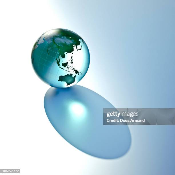 glass earth globe - glass globe stock illustrations