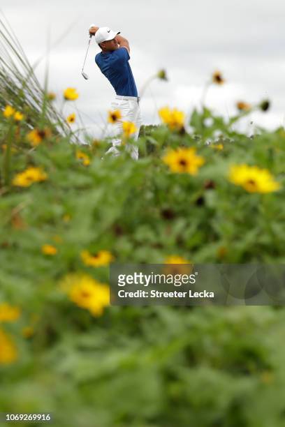 Cameron Champ of the United States plays his shot from the eighth tee during the final round of the RSM Classic at the Sea Island Golf Club Seaside...