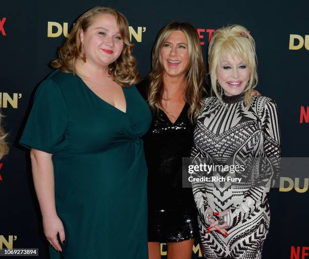 Actors Danielle Macdonald and Jennifer Aniston and singer Dolly Parton attend the premiere of Netflix's "Dumplin'" at TCL Chinese 6 Theatres on...