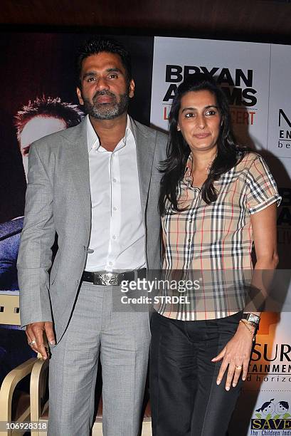Indian Bollywood actor Suniel Shetty with wife Mana Shetty arrive for a press conference in Mumbai on November 17, 2010 to announce the concerts of...