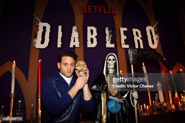 Christopher Von Uckermann holds a skull during the Diablero Bus Tour at La Capilla on December 6, 2018 in Mexico City, Mexico.