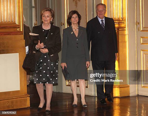 Queen Paola of Belgium, Queen Silvia of Sweden and King Albert of Belgium arrive to attend a conference about " vulnerable children on the run" at...