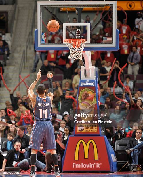 Augustin of the Charlotte Bobcats shoots a free throw during a game against the Detroit Pistons on November 5, 2010 at The Palace of Auburn Hills in...