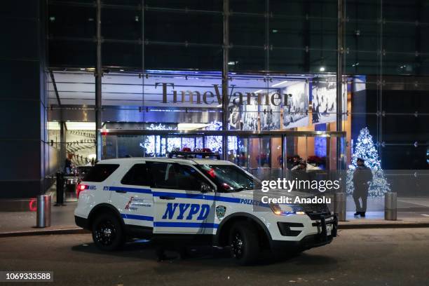 New York Police Department car is parked outside the Time Warner Center building, where CNN's offices are, after it was evacuated by police following...
