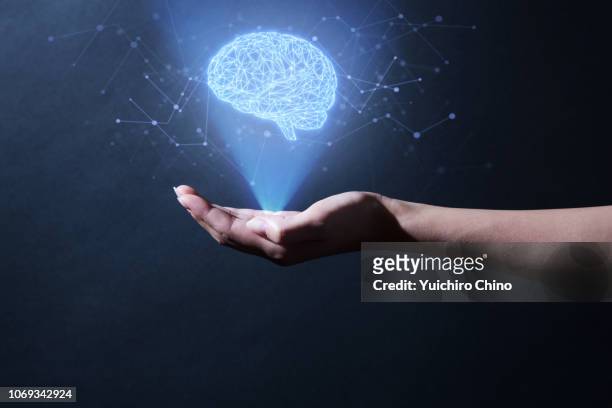 human brain hologram - brain hand stock-fotos und bilder