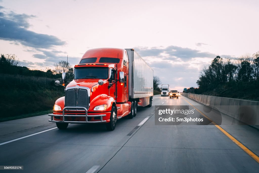 18 wheeler semi-truck on the highway at night
