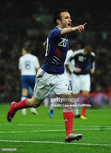 Mathieu Valbuena of France celebrates as he scores their second goal during the international friendly match between England and France at Wembley...