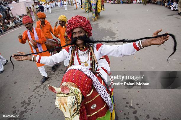 The world record holder for the longest mustache in the world shows off his achievement as thousands of people and dancers from all over Rajasthan...