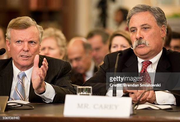 Chase Carey, Deputy Chairman and Chief Operating Officer of News Corporation, listens to Tom Rutledge, Chief Operating Officer of Cablevision Systems...