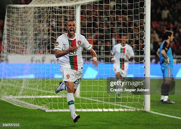 Carlos Martins of Portugal celebrates scoring his sides opening goal as goalkeeper Iker Casillas of Spain stands dejected during the International...