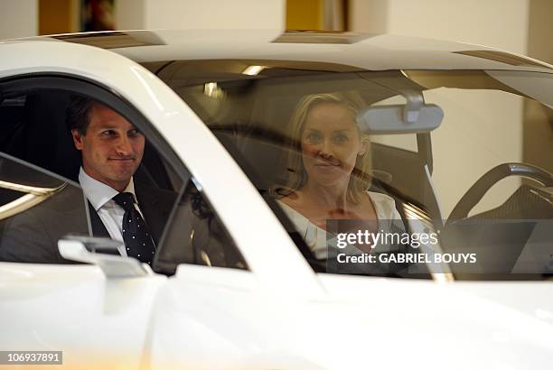 Actress Sharon Stone and Lotus CEO Dany Bahar unveil the new Lotus Esprit during the new during the press day of the LA Auto Show in Los Angeles,...