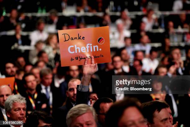 Party member holds up a sign reading 'Thank you chief' as Angela Merkel, Germany's chancellor and Christian Democrat Union leader, delivers her...