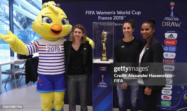 Mascot Ettie of the FIFA Women's World Cup 2019 France pose with Marinette Pichon of France, Carli Lloyd of USA and Laura Georges of France next to...