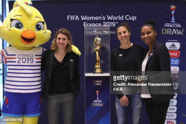 Mascot Ettie of the FIFA Women's World Cup 2019 France pose with Marinette Pichon of France, Carli Lloyd of USA and Laura Georges of France next to...