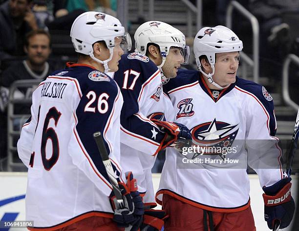 Derek Dorsett of the Columbus Blue Jackets celebrates his goal with Andrew Murray and Samuel Pahlsson for a 1-0 lead over the Los Angeles Kings...