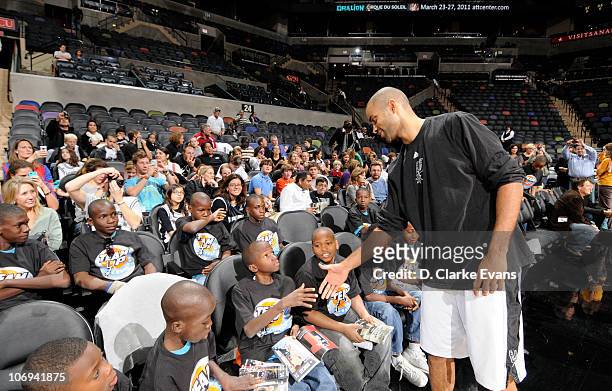 Tony Parker of the San Antonio Spurs visits with Les Petits Chanteurs, an all boys Haitian choir traveling the country to raise money for their...